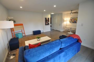Sunnyvale apartment for rent - a living room with a blue couch and a coffee table