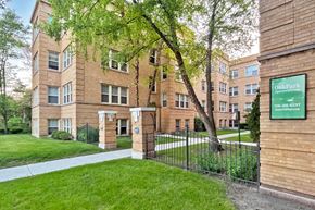 Oak Park apartment for rent - A brick building with a green sign that says Oak Farms.