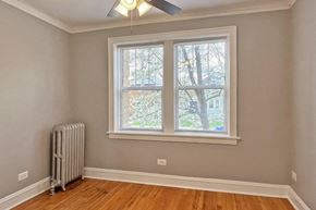 Oak Park apartment for rent - A room with a window and a radiator on the floor.