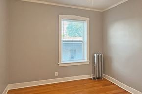 Oak Park apartment for rent - A room with a window and a radiator on the floor.