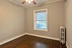 Oak Park apartment for rent - A room with a window and a fan on the ceiling.