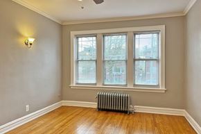 Oak Park apartment for rent - A room with a window and a radiator on the floor.
