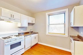 Oak Park apartment for rent - a kitchen with white appliances and a window