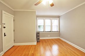 Oak Park apartment for rent - an empty room with a window and a ceiling fan