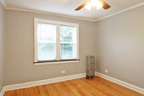 Oak Park apartment for rent - an empty living room with a radiator and two windows