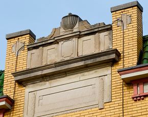 Oak Park apartment for rent - the top of a yellow building with a shell on top