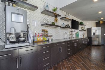 Integrated two-story clubhouse with self-serve barista bar