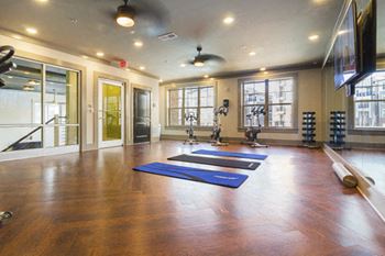 Two-story fitness center with yoga studio and fitness on-demand
