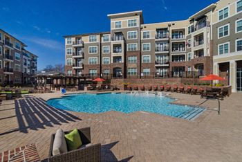 Resort-style saltwater swimming pool with submerged tanning shelf