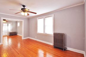 Oak Park apartment for rent - an empty room with wood floors and a ceiling fan
