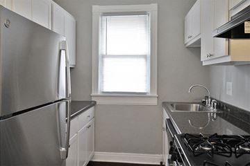 Oak Park apartment for rent - a kitchen with a stove and a sink and a refrigerator