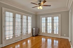 Oak Park apartment for rent - A room with a ceiling fan and a radiator on the floor.