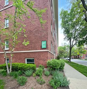 Oak Park apartment for rent - A red brick building with a green sign on it.