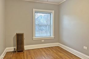 Oak Park apartment for rent - A room with a window and a radiator on the floor.
