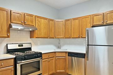 Oak Park apartment for rent - A kitchen with wooden cabinets and stainless steel appliances.