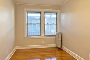 Oak Park apartment for rent - A room with a window and a radiator on the floor.