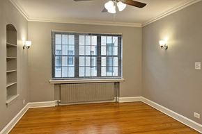 Oak Park apartment for rent - A room with a window and a fan on the ceiling.
