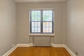 Oak Park apartment for rent - A room with a window and a radiator on the floor.