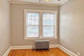 Forest Park apartment for rent - A room with a window and a radiator on the floor.