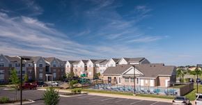 Charles Town apartment for rent - an apartment building with a pool in front of it