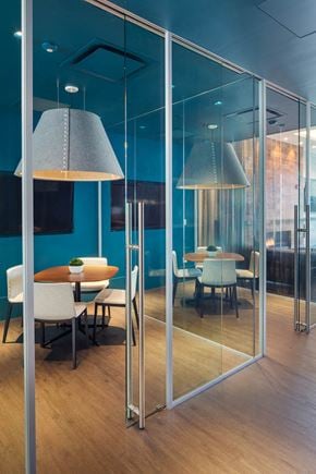 Medford apartment for rent - a conference room with glass walls and tables and chairs