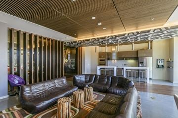 San Francisco apartment for rent - a large living room with leather couches and a rug