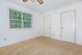 Clifton Park apartment for rent - an empty bedroom with a window and a door