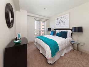 Quincy apartment for rent - a bedroom with a bed and a window