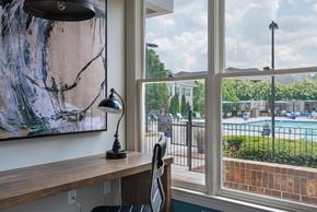 Chapel Hill apartment for rent - views of the pool from a home office with a desk and a large window
