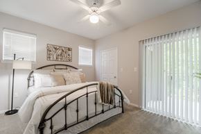 Lewisville apartment for rent - Bedroom with walk-in closet and private patio  at Edgewood Village, Lewisville, TX