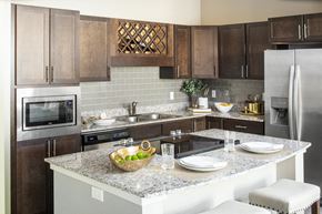 Lincoln apartment for rent - a modern kitchen with stainless steel appliances and granite counter tops