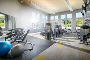 Lincoln apartment for rent - a gym with cardio equipment and windows in a building
