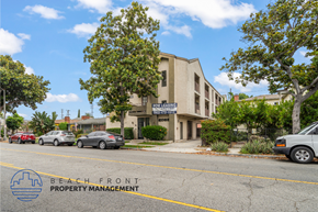 Long Beach apartment for rent - A building with the sign "BEACH FRONT PROPERTY MANAGEMENT" is surrounded by trees and cars on the street.