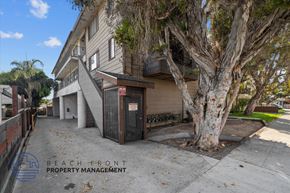 Long Beach apartment for rent - the entrance to a building with a tree in front of it