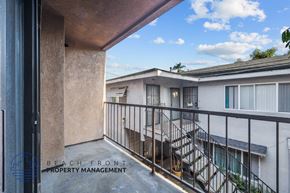 Long Beach apartment for rent - a balcony with a view of a building and a staircase