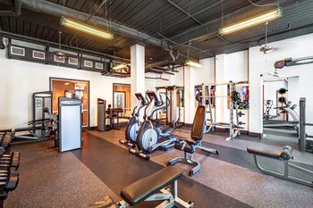 24-Hour fitness studio with cardio theater and free weights