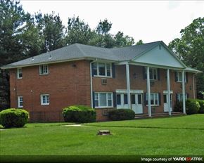Denville apartment for rent - A brick house with a white door and windows.