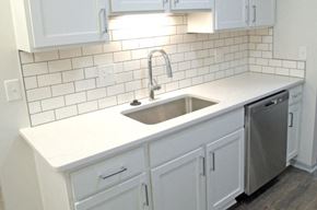 Canton apartment for rent - Modernized kitchen featuring white shaker cabinets and a subway tile backsplash