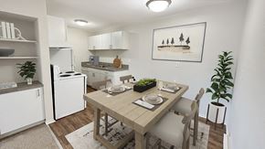 Madison Heights apartment for rent - Cheerful dining area, kitchen with many updates, pantry, wood plank flooring.