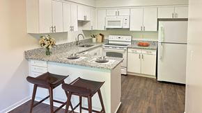 Farmington Hills townhouse for rent - Luxury features like crown molding, vaulted ceilings, sun-drenched bay windows, park-like views and skylights.
