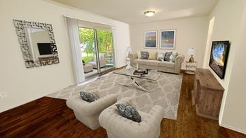 Oak Park townhouse for rent - A living room with a grey sofa and a white rug.