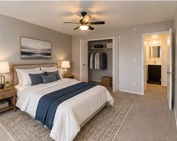 Berkley apartment for rent - A bedroom with a large bed and a ceiling fan.