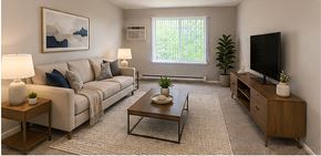 Berkley apartment for rent - A living room with a couch, coffee table, and television.