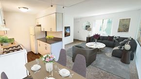 Detroit apartment for rent - A modern kitchen with a dining table set for two.