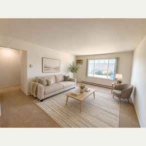Farmington Hills apartment for rent - A living room with a couch, chair, and coffee table.