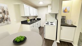 Southfield apartment for rent - A nice sized updated kitchen with white shaker cabinetry and dramatic soapstone looking countertops along with contemporary fixtures and wood plank flooring.