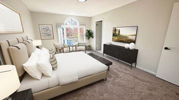 Auburn Hills townhouse for rent - A living room with a large bed and a painting on the wall.