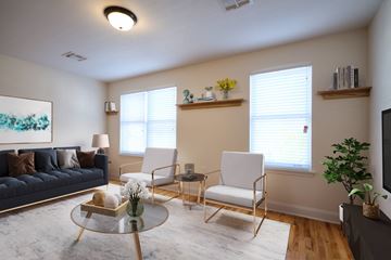 Woodbury apartment for rent - a living room with a couch and chairs and a table