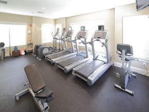 Brookfield apartment for rent - a gym with several treadmills and a tv