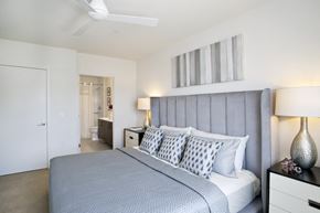 Ossining apartment for rent - a bedroom with a large bed and a ceiling fan